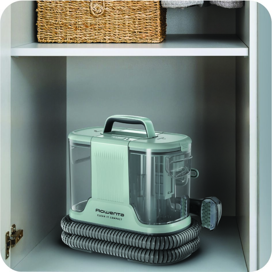 Čistič skvrn Rowenta IN3020F0 Clean It Compact Animal zelený Tepovač Rowenta IN3020F0 Clean It Compact Animal uložený ve skříni