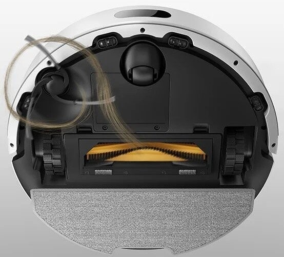 Robotický vysavač Dreame F20 bílý Na robotický vysavač Dreame F20 se díváme zespodu - zobrazení speciálních zubů zabraňující zamotávání vlasů do hlavního kartáče.