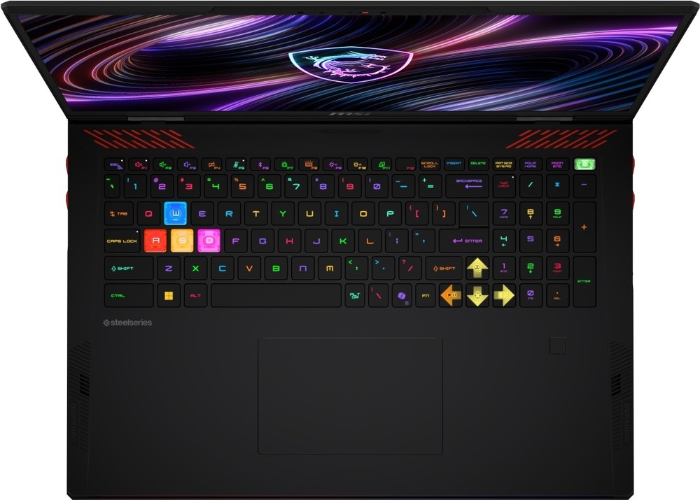 Notebook MSI Raider 18 Max HX A2WI-1042CZ černý Pohled shora na otevřený herní laptop Raider 18 Max HX A2W s RGB s podsvícenou klávesnicí a velkým touchpadem