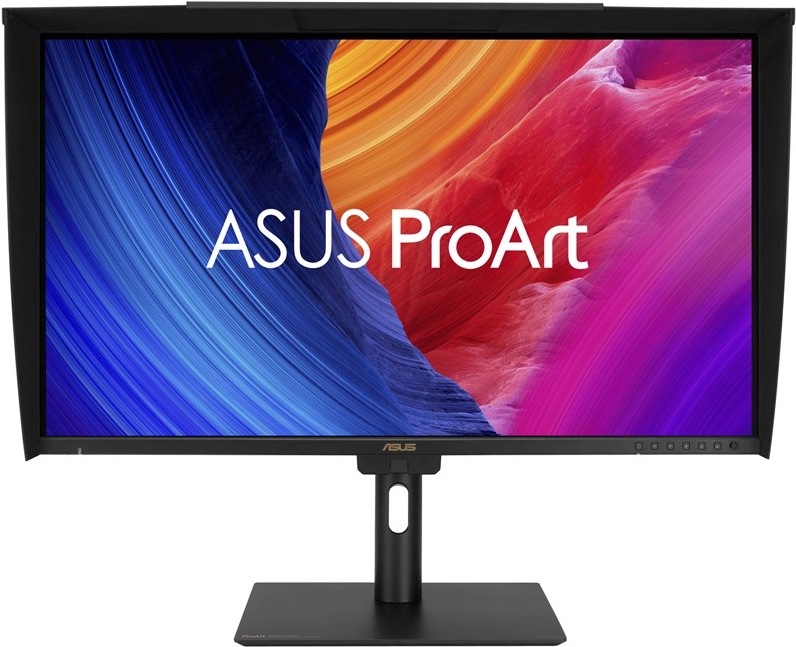 Na obrázku je monitor Asus ProArt PA27UCGE 27" z čelního pohledu. Monitor má černý stojan s plochou základnou a otvor ve sloupku pro vedení kabelů. Displej je doplněný o černou stínicí clonu po stranách a nahoře, která pomáhá omezit odlesky při práci s obrazem. Na obrazovce je barevná grafika ASUS ProArt v modrých, oranžových, červených a fialových tónech. Vpravo dole na spodním rámečku jsou vidět ovládací tlačítka monitoru.