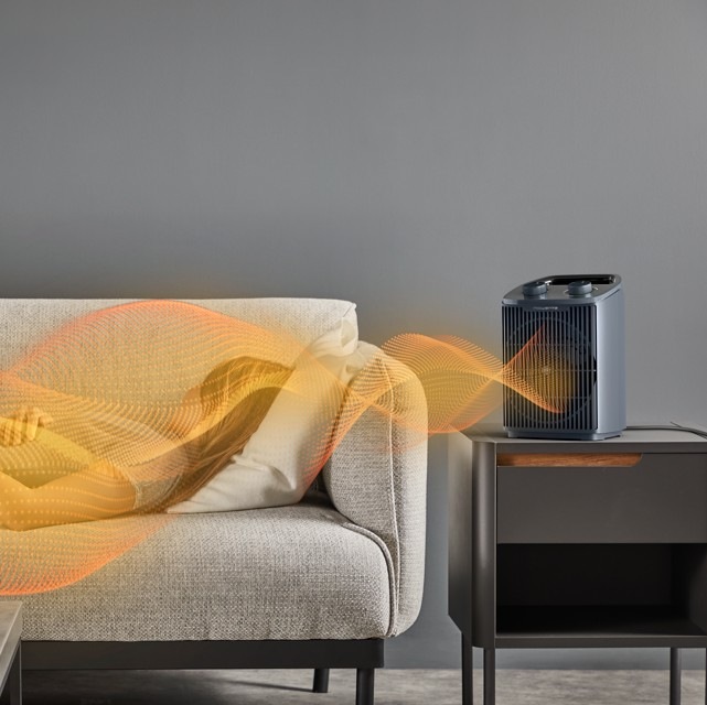 Teplovzdušný ventilátor Rowenta SO2351F0 Intense Comfort šedý Teplovzdušný ventilátor Rowenta SO2351F0 Intense Comfort v obývacím pokoji vyzařuje teplo