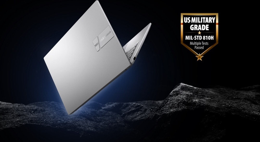Notebook ASUS Vivobook 14 s certifikací odolnosti MIL-STD 810H na tmavém pozadí