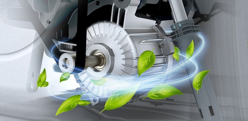 Pračka Gorenje G400 WG484A31B UltraClean černá Detail na invertorový motor pračky gorenje, kolem něho poletují zelené listky.