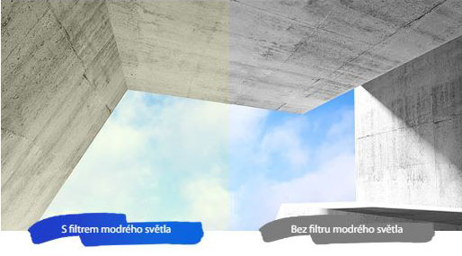 Herní monitor Asus VP227HF černý Rozdělený obraz betonové zastřešené konstrukce pod modrou oblohou. Levá polovina s modrým světelným filtrem zobrazuje teplejší tóny; pravá polovina bez filtru se jeví jako chladnější.