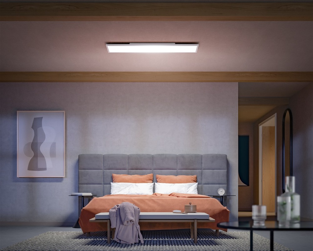 Stropní svítidlo Philips Surimu Hue Panel, 60W, 120x30 cm, White and Color Ambiance bílé Pohled na obývací pokoj nasvětlený osvětlením Philips Surimu Hue s bílým teplým světlem