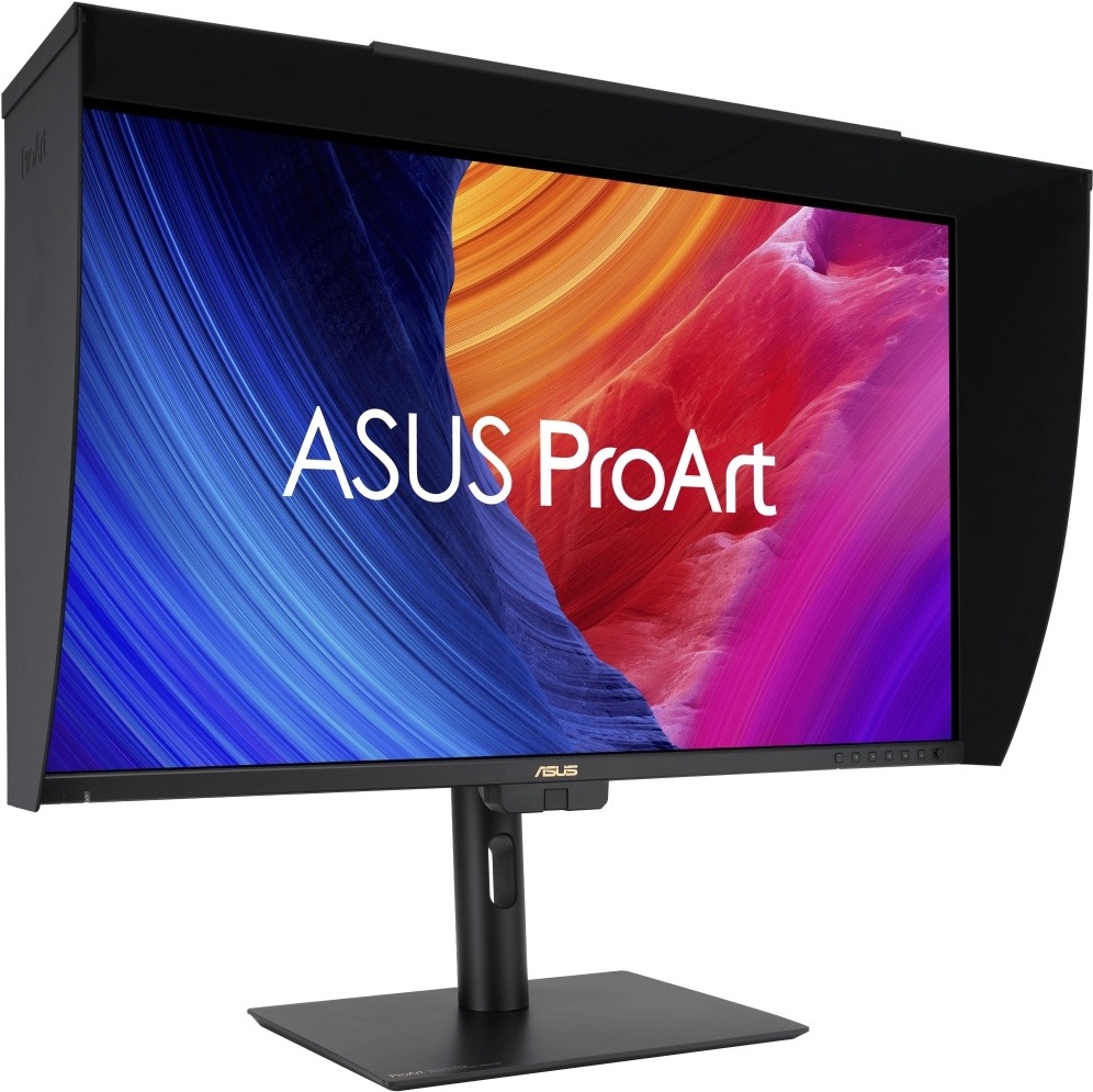 Monitor Asus ProArt PA27UCGE černý Na obrázku je monitor Asus ProArt PA27UCGE 27" z předního šikmého pohledu. Monitor má černou stínicí clonu po horní a bočních stranách, která omezuje rušivé světlo a odlesky při práci s obrazem. Displej stojí na černém výškově nastavitelném stojanu s plochou základnou a otvorem pro vedení kabelů. Na obrazovce je barevná grafika ASUS ProArt v modrých, oranžových, červených a fialových odstínech. Vpravo dole pod displejem jsou vidět ovládací tlačítka monitoru.