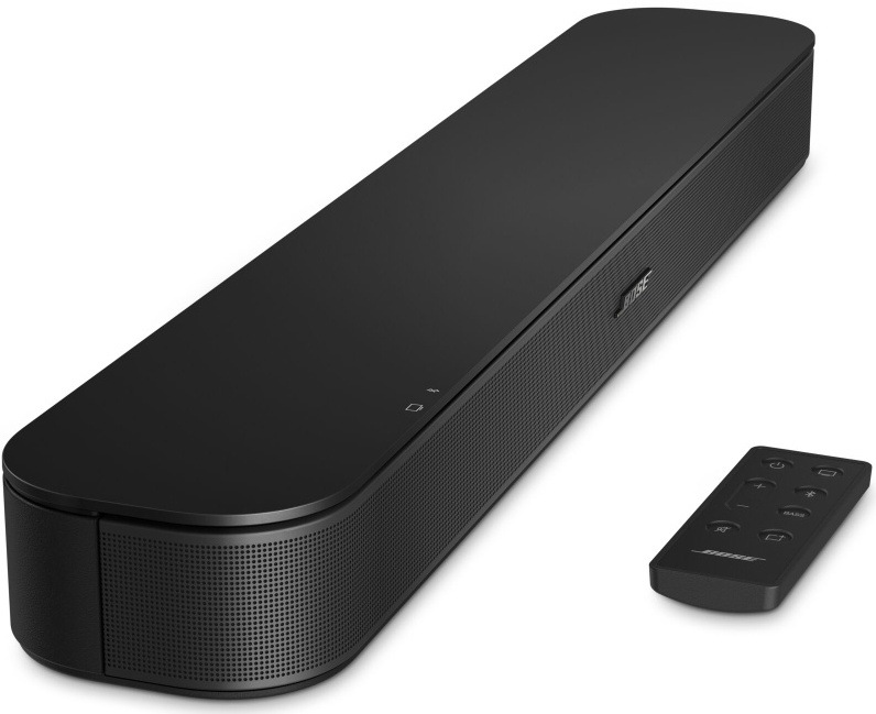 Soundbar Bose TV Speaker s dálkovým ovladačem položeným vedle.