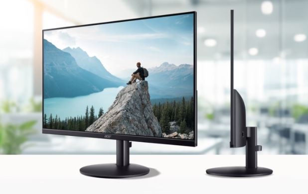 Tenký monitor Acer zboku a zepředu s obrazem muže sedícího  na skále
