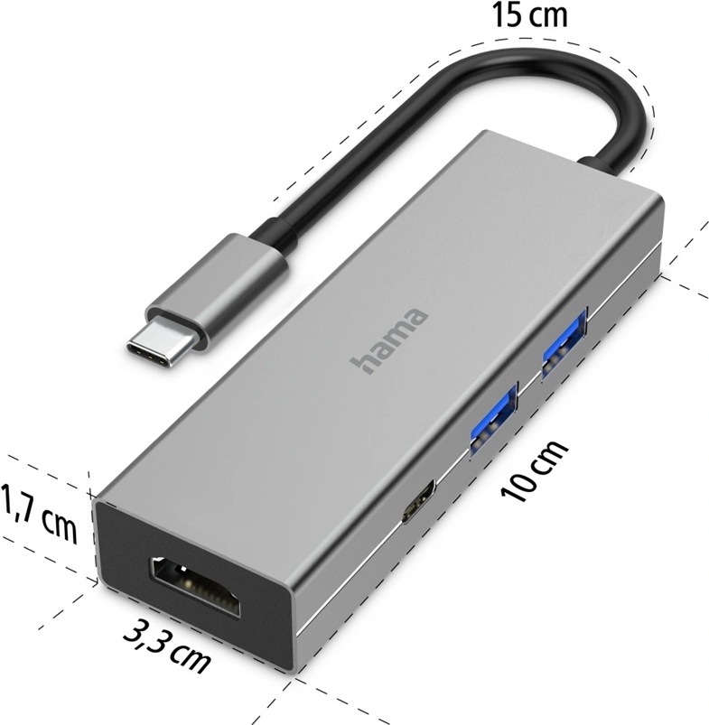 USB Hub Hama Multiport šedý Na obrázku je šedý USB-C hub Hama Multiport zachycený šikmo zepředu a doplněný rozměry. Má úzké kovové tělo s jednoduchým hranatým designem, na horní straně logo hama a z jednoho konce krátký černý kabel zakončený USB-C konektorem. Na čele je HDMI konektor, na boku dva modře označené USB porty a jeden menší USB-C port. Kolem zařízení jsou vyznačené rozměry: délka těla 10 cm, šířka 3,3 cm, výška 1,7 cm a délka kabelu 15 cm.