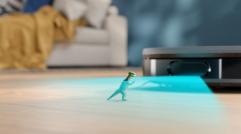 Robotický vysavač se stanicí Philips XU9100/10 skenuje malou hračku dinosaura
