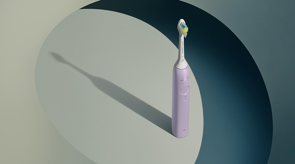 Stojící kartáček Philips HX4033/27 Sonicare 3100 a za ním stín