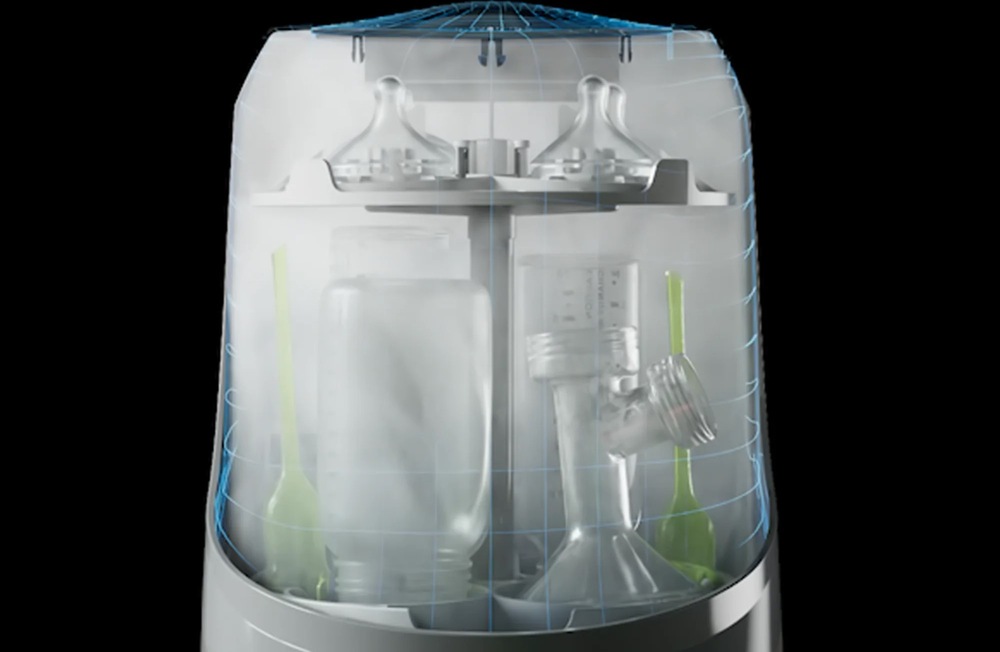 Sterilizátor Baby Brezza Bottle Washer White bílý Pohled na proces sušení horkým filtrovaným vzduchem, uvnitř přístroje Baby Brezza Bottle Washer White se nachází kojenecké lahvičky a savičky.