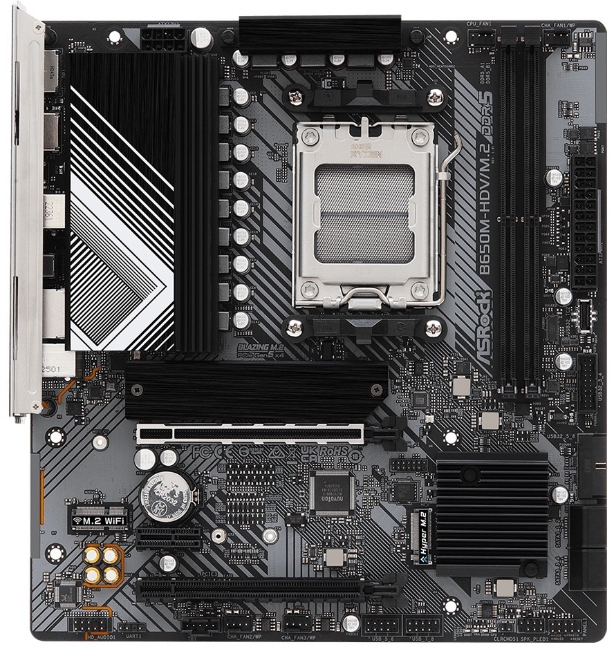 Základní deska ASRock B650M-HDV/M.2 Shora vidíte micro ATX desku s blokem zadních portů vlevo nahoře. Uprostřed je patice procesoru AM5, po pravém okraji jsou 2 sloty pro DDR5 a 24pin napájení. Dole jsou dlouhé PCIe sloty pro grafiku, mezi nimi a paticí bývají M.2 pozice pro SSD a u spodní pravé části konektory SATA.