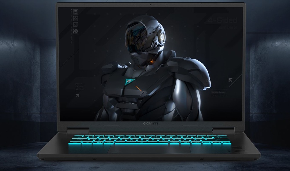 Notebook GIGABYTE GAMING A16 3WHK3CZ894SH černý Elegantní notebook s futuristickým obrněným robotem na obrazovce. Klávesnice svítí modrozelenou barvou a je umístěna v tlumeně osvětlené průmyslově vypadající místnosti.