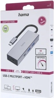 Na obrázku je krabička od USB-C hubu Hama Multiport. Na přední straně obalu je vyfocený samotný šedý hub s krátkým USB-C kabelem. Dále jsou tam výrazné popisky a ikony, které upozorňují na 4 porty, podporu 4K Ultra HD a vysokou přenosovou rychlost. V dolní části je název produktu USB-C Multiport + HDMI. Obal působí čistě, přehledně a jasně ukazuje, k čemu zařízení slouží.