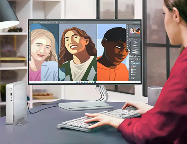 PC mini Lenovo IdeaCentre Mini 01IRH10R černý Žena vytvářející grafiku má vedle monitoru postavený počítač Lenovo IdeaCentre Mini s vertikálním stojanem
