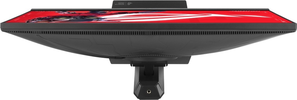 Herní monitor Asus ROG Strix XG248QSG Ace černý Na obrázku je herní monitor ASUS ROG Strix z horního pohledu. Je vidět tenké tělo displeje, horní hrana obrazovky s červenou grafikou a dlouhá větrací mřížka po celé zadní části. Uprostřed vystupuje uchycení stojanu, které monitor drží na výškově nastavitelném podstavci. Zadní kryt má černé provedení s jemným herním vzorem.