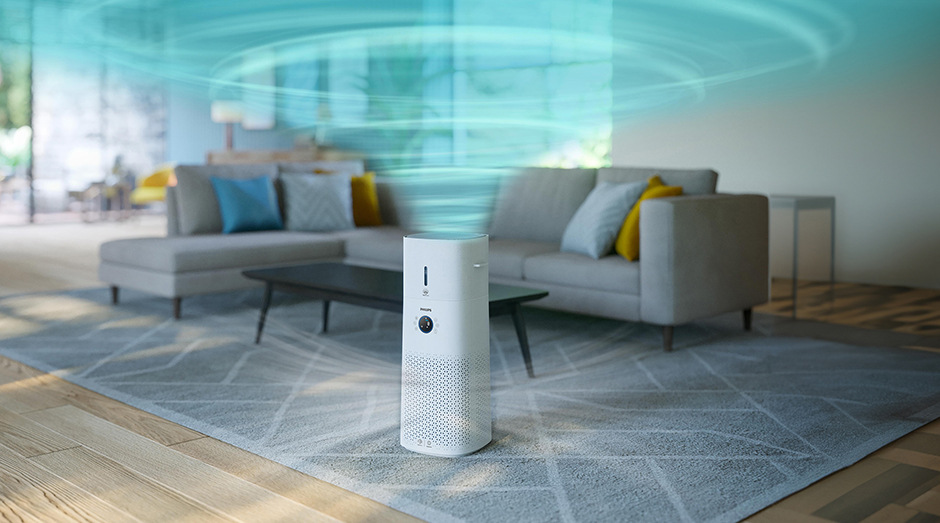 Čistička vzduchu Philips AC3737/10 Series 3000 vypouštějící vír v obývacím pokoji, znázorňující čištění