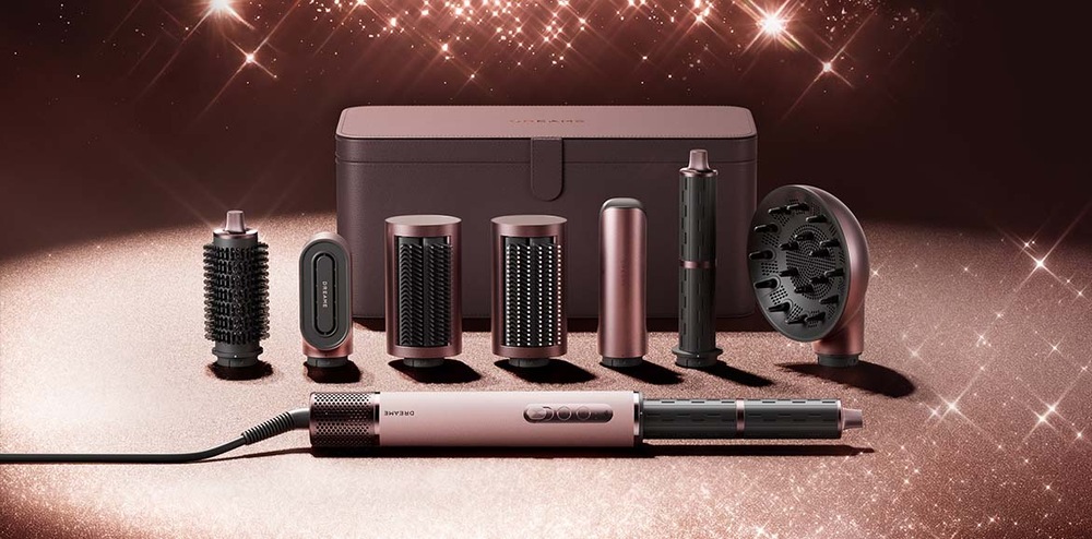 Detailní pohled na růžové úložné pouzdro a vyměnitelné příslušenství Dreame AirStyle Pro HI