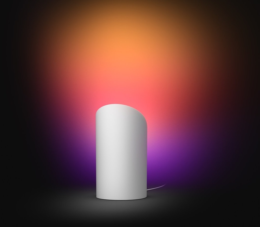 Stolní svítidlo Philips Hue Wall washer, 20W, EU/UK, White and Color Gradient bílá Lampička Philips Hue Wall washer s ukázkou projekce na stěnu, vytvářející příjemnou atmosféru