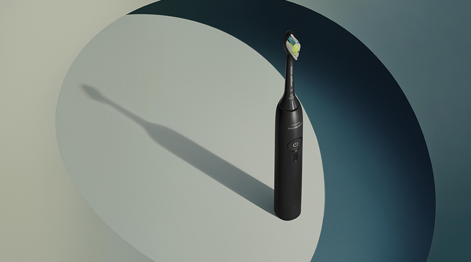 Stojící kartáček Philips HX4033/32 Sonicare 3100 a za ním stín