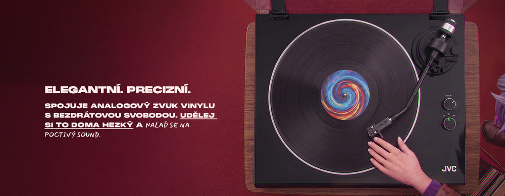 Černý gramofon JVC s roztatočenou vinyl deskou z pohledu shora s textem „Elegantní. Precizní. Spojuje analogový zvuk vinylu s bezdrátovou svobodou.“