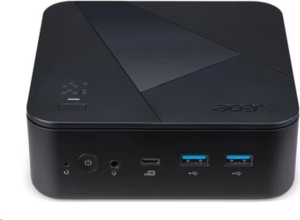 Na obrázku je detail přední části mini počítače Acer Revo Box RB102-BARR R5 v černém provedení. Na horní straně je decentní geometrický vzor a logo Acer. Vpředu jsou dobře vidět ovládací prvky a konektory: tlačítko napájení, audio konektor, USB-C a dva USB-A porty s modrým vnitřkem. Zařízení má nízké kompaktní tělo se zaoblenými rohy a působí jednoduše a prakticky.