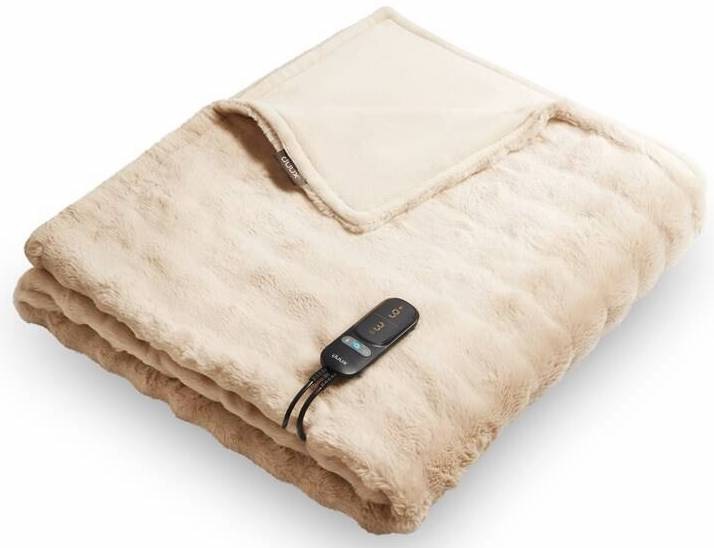 Béžová vyhřívací deka Duux DXOB11 Yentl Cuddle 200×200 cm z měkkého chlupatého polyesteru, složená s odnímatelným ovladačem a rovnoměrnou distribucí tepla.