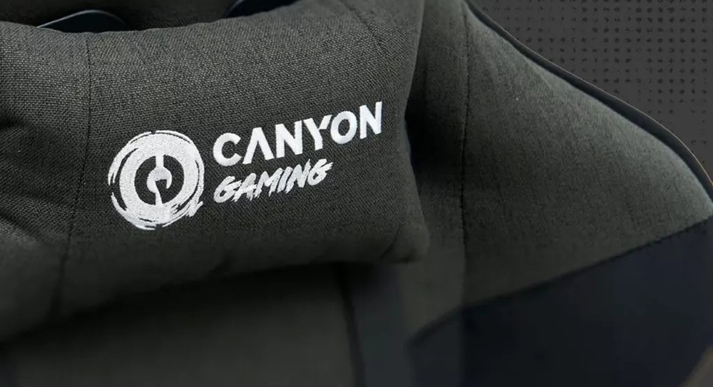 Herní židle Canyon Crest Fabric šedá Ke správnému držení těla poslouží u židle Canyon Crest Fabric dodávaná bederní a hlavová opěrka