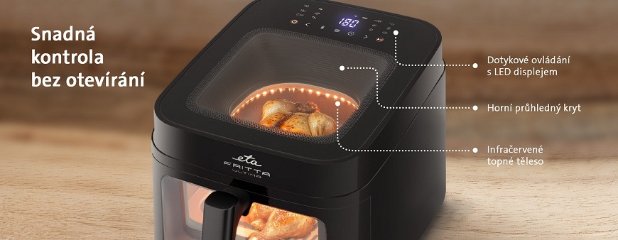 Detailní pohled na fritézu ETA Fritta Ultima s kuřetem uvnitř. Popisky ukazují na Dotykové ovládání s LED displejem, Horní průhledný kryt a Infračervené topné těleso