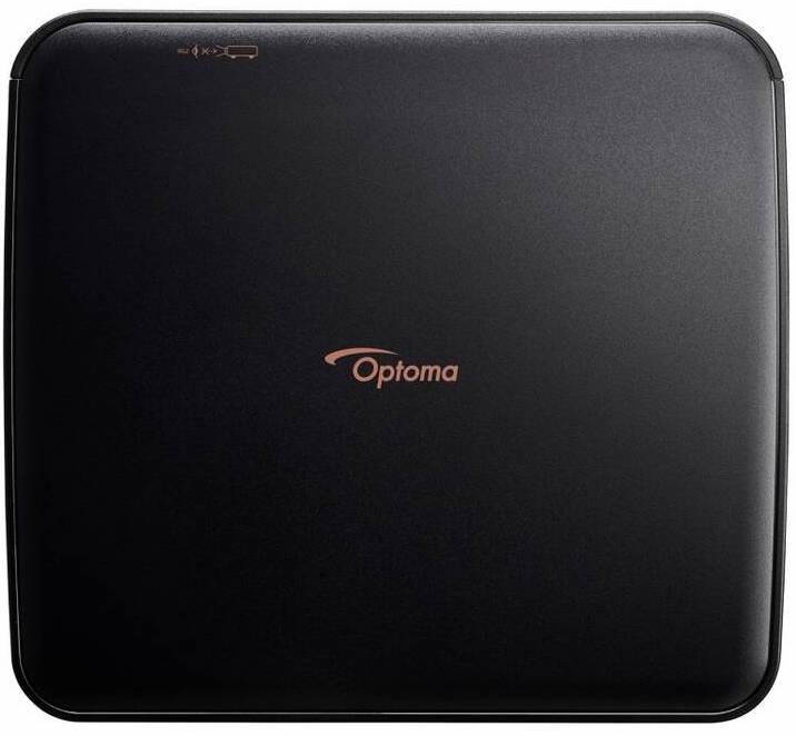 Projektor Optoma Photon Life PK32 černý Horní pohled na matně černé tělo projektoru Optoma PK32 s čistým minimalistickým designem a odolným povrchem vhodným pro přenášení