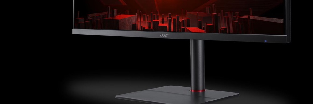 Herní monitor Acer Nitro XV345CURX černý Záběr na herní monitor s futuristicky vypadajícím městem na obrazovce před černým pozadím.