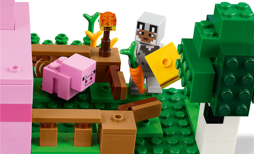 Minecraftová základna ve tvaru prasátka ukrývá útulný interiér s pracovním stolem, postelí a knihovnou.
