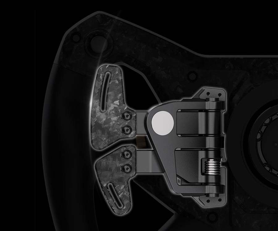 Volant Moza Racing KS Pro hliník Detailní záběr na mechanismus pádla futuristického černého herního volantu na tmavém pozadí, který dává vyniknout propracovaným kovovým detailům a elegantnímu designu.