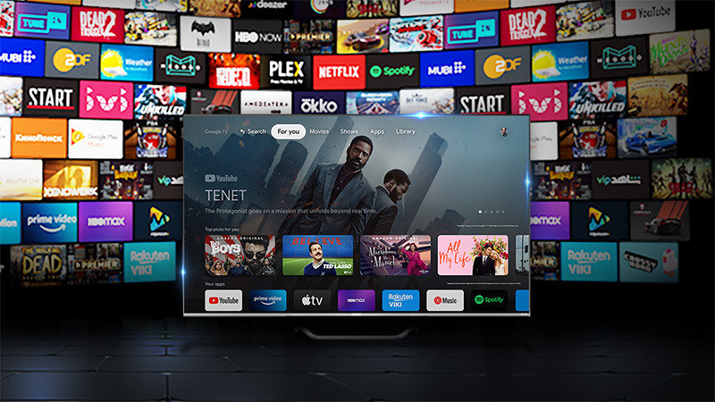 Televize Haier H43S80FUX televize haier H43s80FUX, v pozadí i na obrazovce jsou různé aplikace