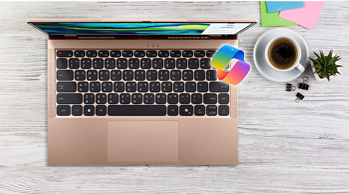 Pracovní stůl s kávou a laptopem Acer Aspire Lite 15