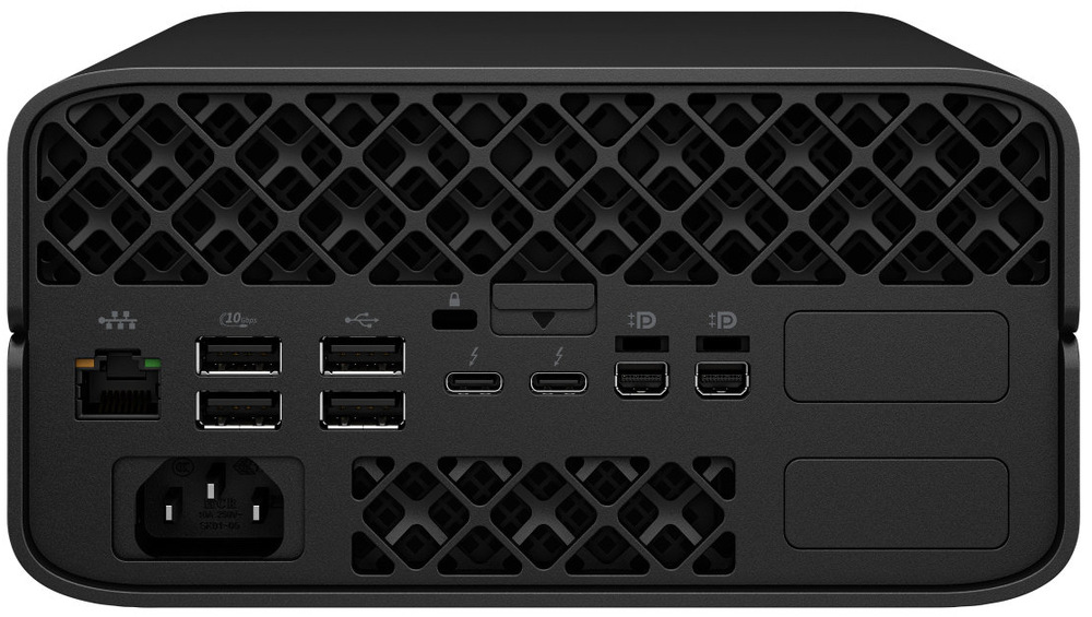 PC mini HP Z2 Mini G1a černý Na obrázku je zadní strana kompaktního stolního počítače HP Z2 Mini G1a AMD Ryzen AI Max+ PRO 395 v černém provedení. Horní část zabírá výrazná ventilační mřížka s geometrickým vzorem. Vlevo je síťový port, vedle několik USB portů, dva USB-C konektory a dva obrazové výstupy DisplayPort. Uprostřed nahoře je i zámek a malé tlačítko nebo pojistka. Dole vlevo je konektor pro napájecí kabel a uprostřed další větrací otvor. Zadní panel působí přehledně, technicky a nabízí bohatou konektivitu.