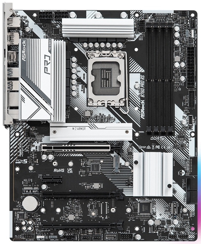 Z horního pohledu je v levé horní části zadní I/O panel s porty pro externí zařízení. Nahoře uprostřed je patice Intel 1700 a vpravo od ní čtyři DDR5 sloty. Na pravém okraji je 24pin napájení a nahoře napájení pro CPU. Uprostřed jsou PCIe sloty pro grafiku a rozšíření, poblíž jsou tři M.2 pozice a na pravé/spodní části čtyři SATA porty. Dole jsou konektory pro přední panel skříně, interní USB, audio, RGB a ventilátory.