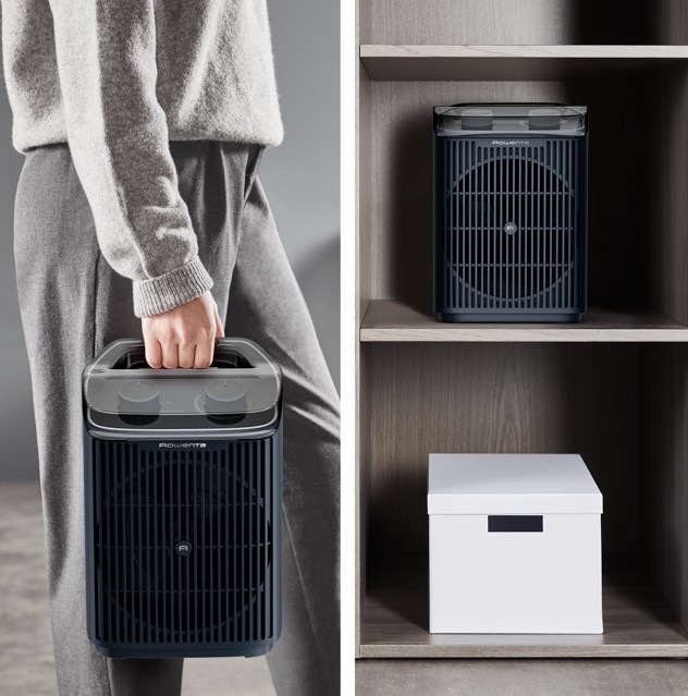 Teplovzdušný ventilátor Rowenta SO6551F0 Intense Comfort Aqua černý Žena přenáší teplovzdušný ventilátor Rowenta SO6551F0 Intense Comfort Aqua do šatny na uložení