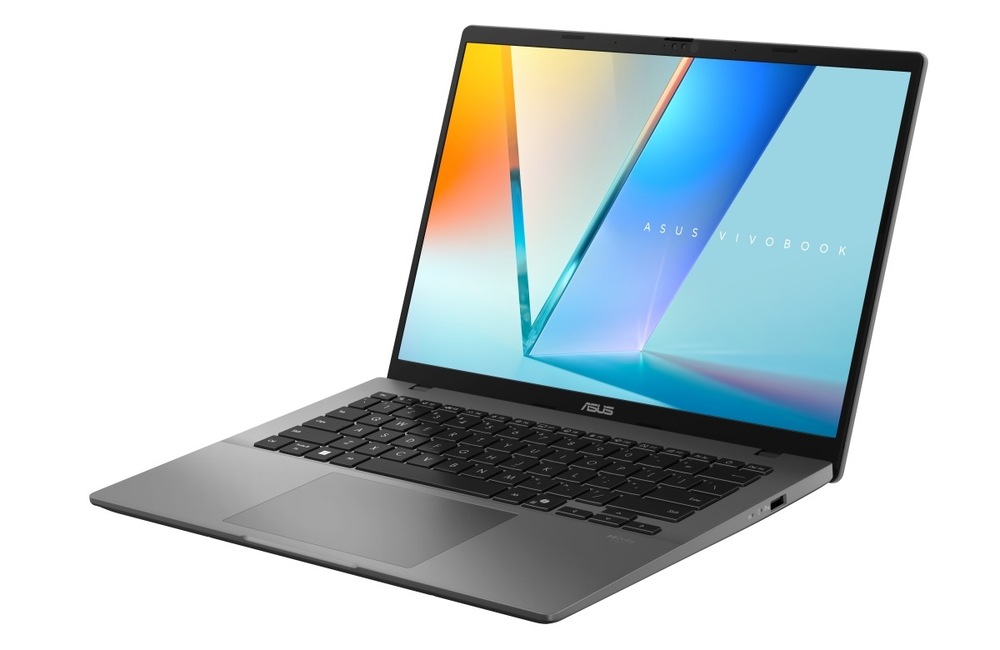 Notebook Asus Vivobook S14 stříbrný Otevřený a zapnutý notebook ASUS Vivobook S 14 otočený doleva