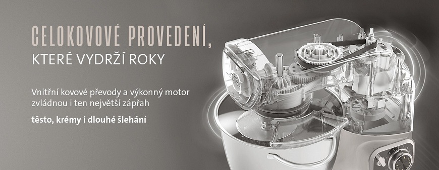 etailní průhled na vnitřní konstrukci kuchyňského robota ETA Gratus. Celokovové provedení a kovové převody pro dlouhou životnost. Text na obrázku potvrzuje, že motor a převody zvládnou těsto, krémy i dlouhé šlehání