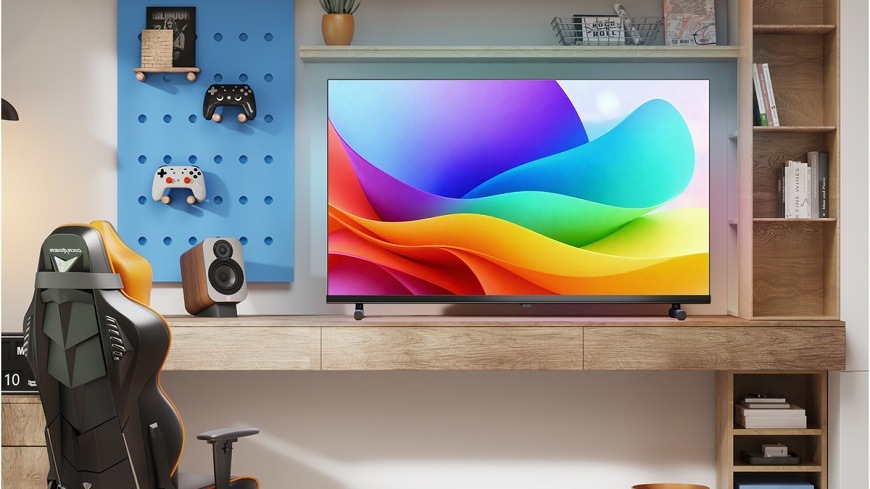 Televize Hisense 40A5S televize Hisense 40A5S s barvami na displeji stojí na stole v herní místnosti