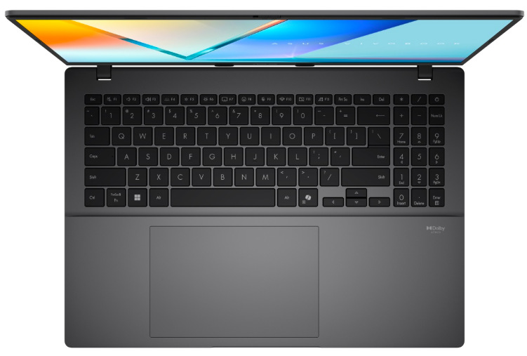 Pohled shora na černou klávesnici s numerickou částí a rozměrný touchpad