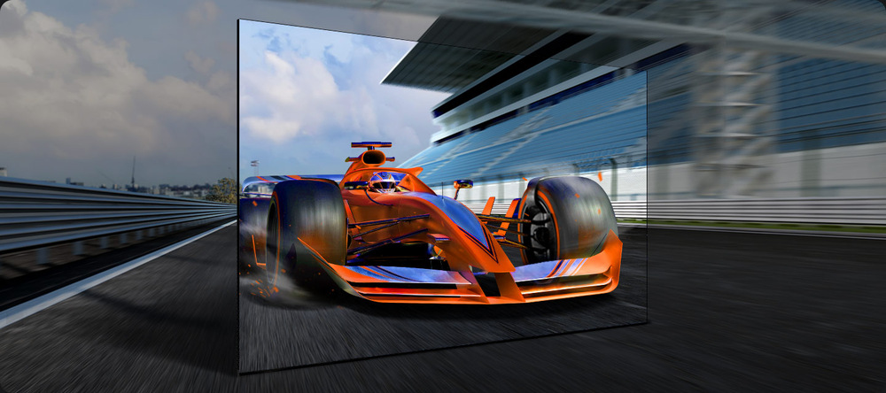 Závodní auto vyjíždějící z televizní obrazovky stojící na závodní dráze - technologie Motion Xcelerator
