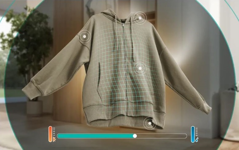 Sušička prádla Gorenje G400 DG48D NatureDry černá mikina, na které jsou vidět body jako senzory sušení, díky kterým sušička ví, kdy má přestat sušit. Ve spodní části je stupnice zbývajícího vlhka v prádle.